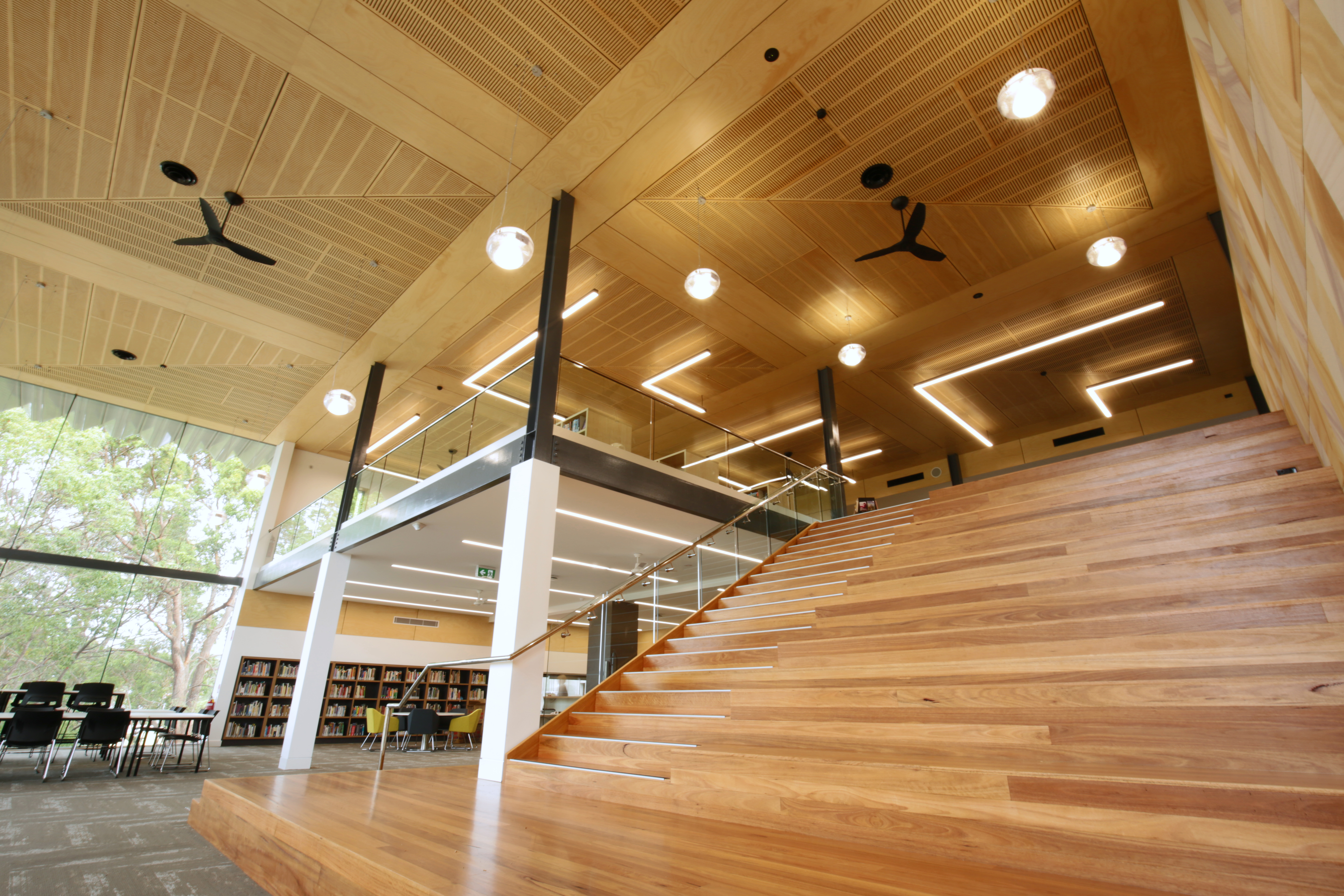 Intellipower commercial electrical installation — library staircase with feature lighting